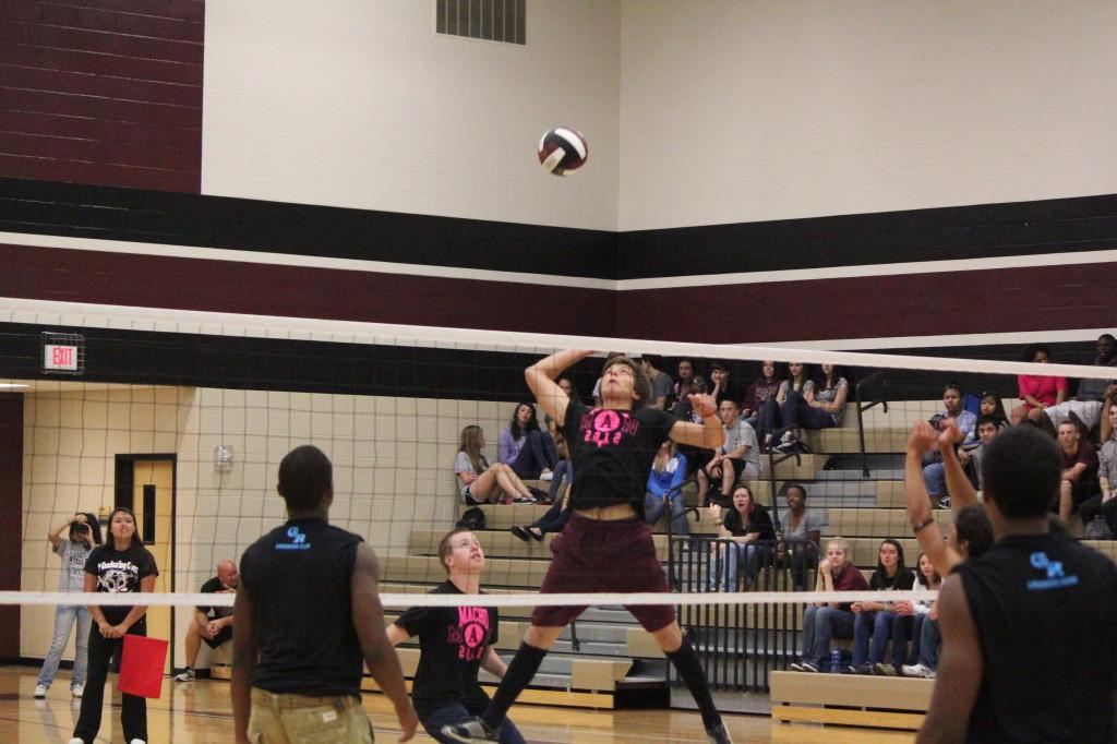 Junior Philip Garza goes for the kill at the Pro-Grad sponsored Macho Man volleyball game.