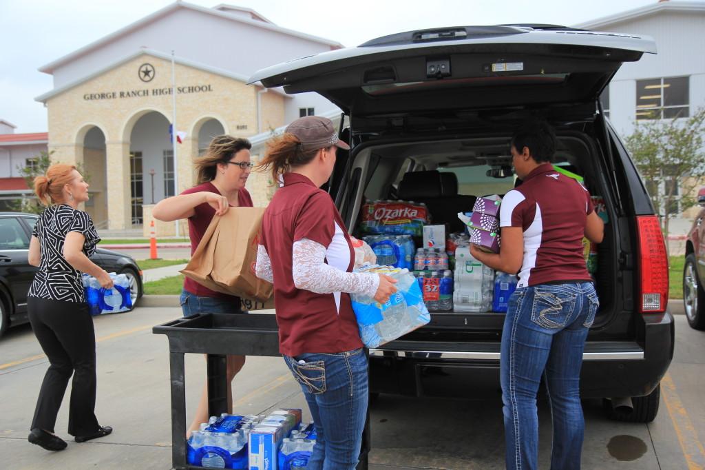 George Ranch PTO members load donations in the back of a vehicle to take to Foster High School the morning of Thursday, April 18. Photo by Mrs. Amanda Respondek