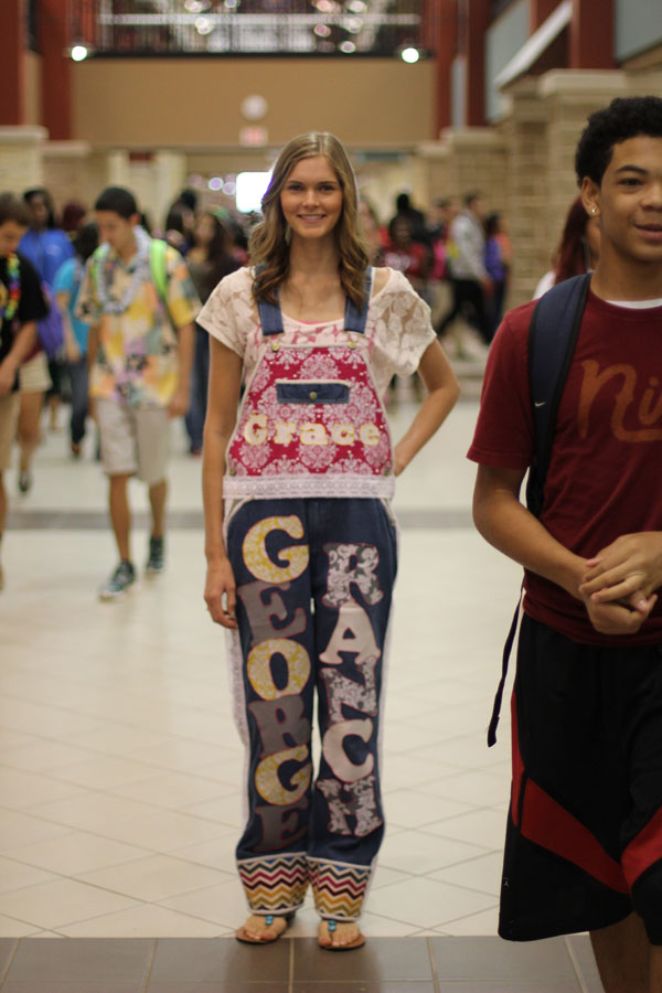 Senior Grace Gallagher fashions her overalls on a home game day.