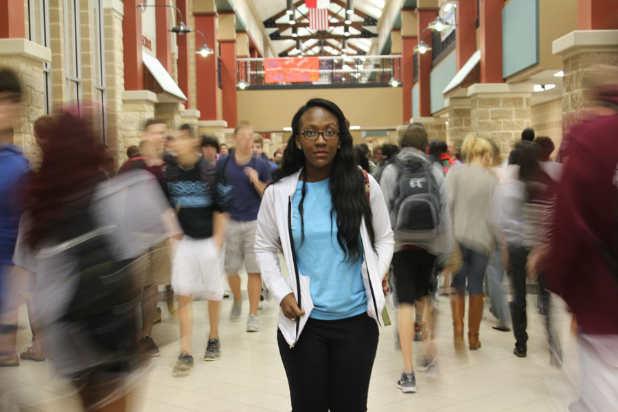 Senior Claire Bonaparte makes her way through Main Street during passing period. 