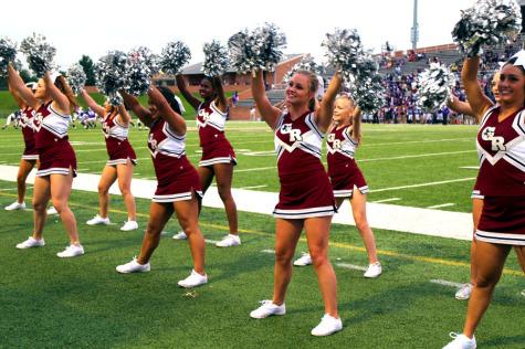 Cheerleading cheering for their school 