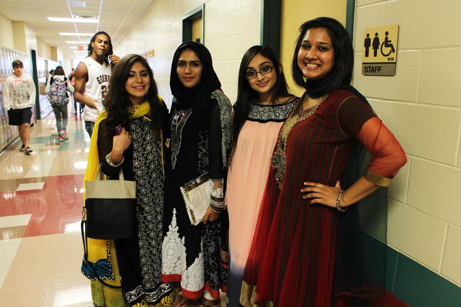 Rebecca Bonilla, Eman Hussain (two on left) and  Sunny Amin (far right) representing their Indian culture. Fatima Ghayour representing her Pakistani culture.