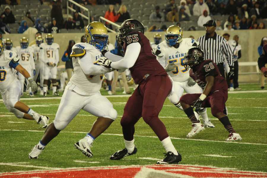 Kingsley Keke and Cameron Brooks holding Elkins offense