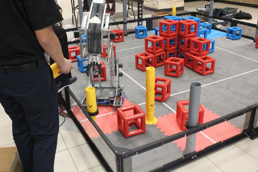 A student testing out the robot's functions.