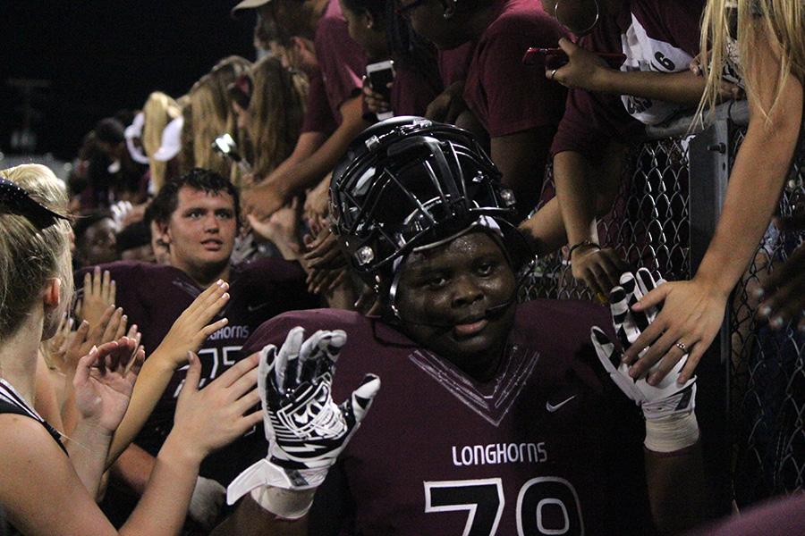 Fellow teammates cheer after the win against Dawson!
