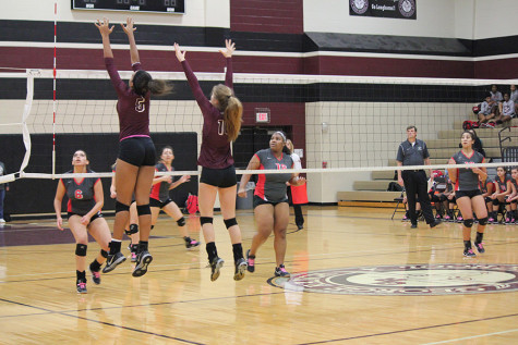 Kennedy Prince and Mattie Ward go up for a block.