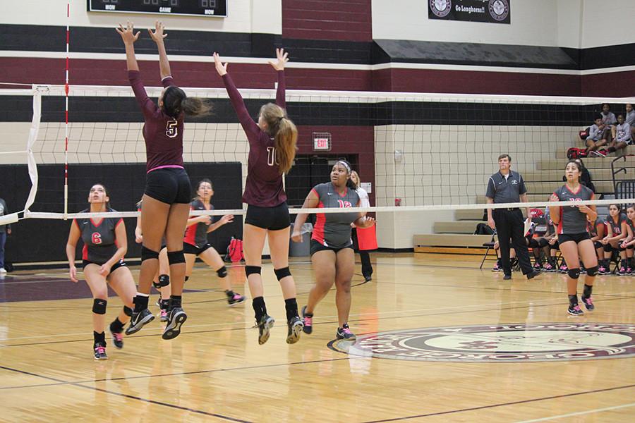 Kennedy Prince and Mattie Ward go up for a block. 