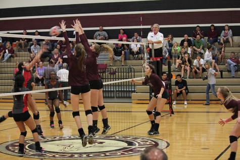 Valerie Valerian and Ambrielle Logan block an attack from Terry. 