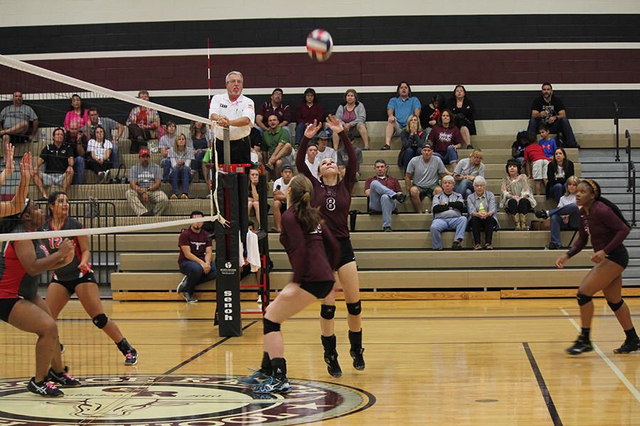 Abbey Messick sets a ball up for the left side. 