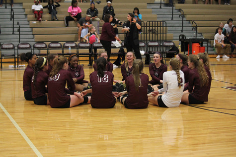 The team gets together to do their end of game chant and roll for the last time on their home court this year. 