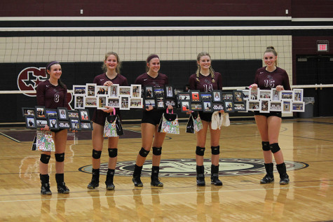 With tears in their eyes, the seniors from left to right Abbey Messick, Mattie Ward, Ainsley Mandell, Alyson Dernehl, and Ambrielle Logan pose for a photo holding a collage of all of their memories that George Ranch volleyball gave them.