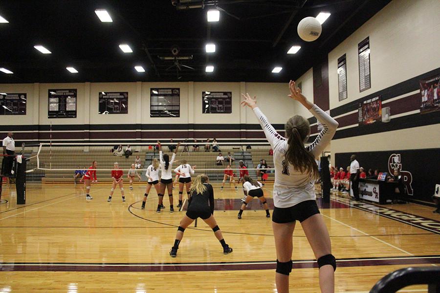 Valerie Valerian sets the ball during the Longhorn Varsity Invitational. 