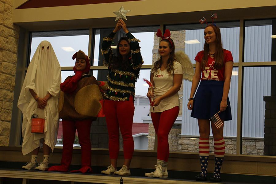 (From Left to Right): Marissa Vrba (Halloween), Demi Sadek (Thanksgiving), Sydney Heikkila (Christmas), Rachel Buchanan (Valentine's Day), Martha Czernuszenko (The Fourth of July) representing five holidays.