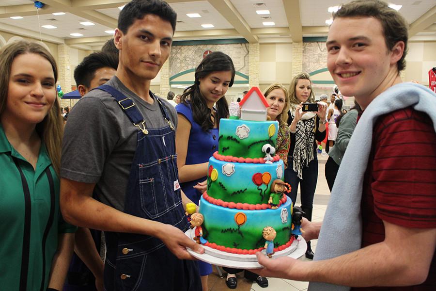 (From Left to Right): Cameron Lavine, Michael Elder, Chloe Oesterreich, David Kvinta showcasing their Peanuts themed cake.