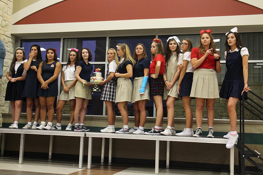 Senior Serve 2015 Elementary themed group displaying their cake for the live auction. Madison Deserf, Erin Templin, Rebecca Davis, Reagan Hanna, Nora Harrison, Karissa Wilson, Haley Hepp, Cassy Moore, Lauren Vela, Brooke Appelbaum, Keaton Milburn, Caroline Burden and Remington Scarlato.