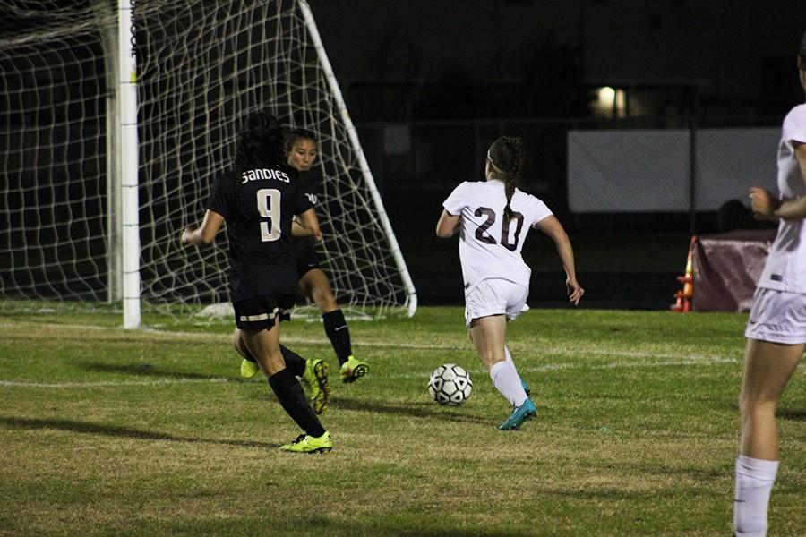 Sophomore Taylor Rech runs toward the goal in hopes of scoring