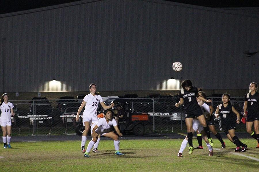 Freshman Celeste Ruiz bends down in preparation to head the ball