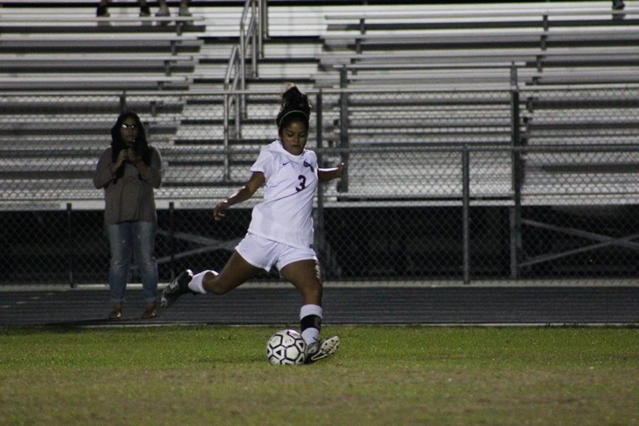 Senior Shreya  Desai cocks back to passs the ball to her teammate