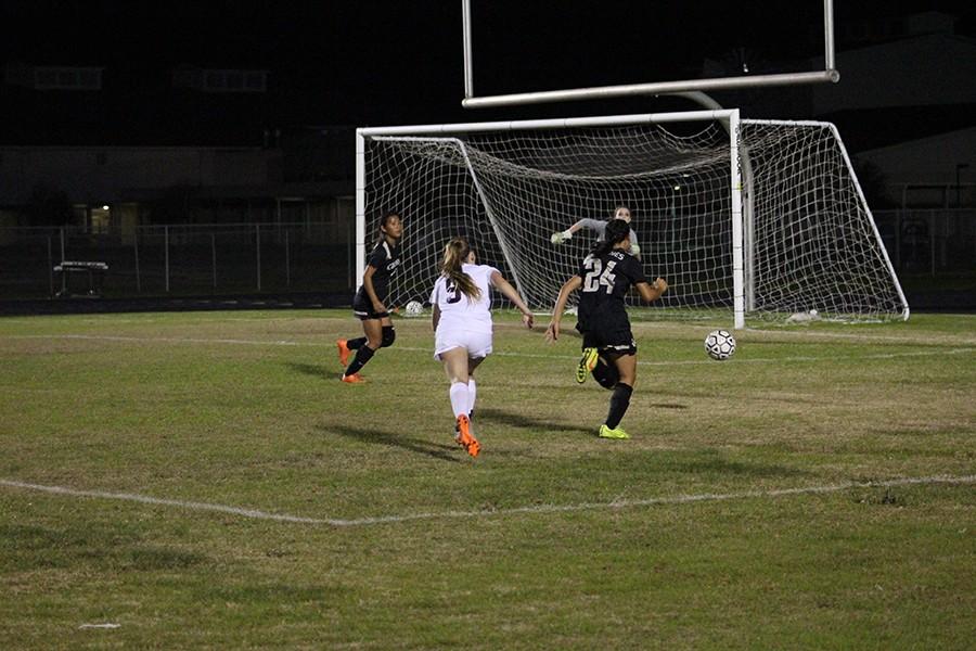 Senior Austin Martz races to the ball