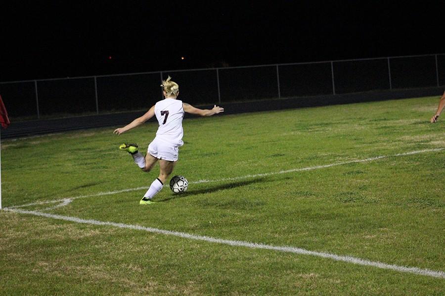 Junior Gabby Galvan attempts to launch the ball across the field towards the goal