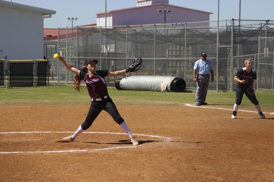 Lexi Tovar powerfully extends for her pitch. 