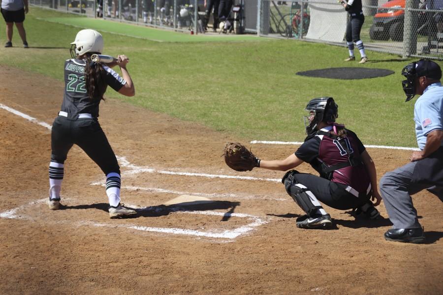 Kim Williams stretches to catch the pitch. 