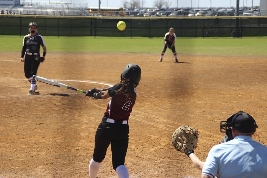 Lily Pearson hits a line drive to center field. 