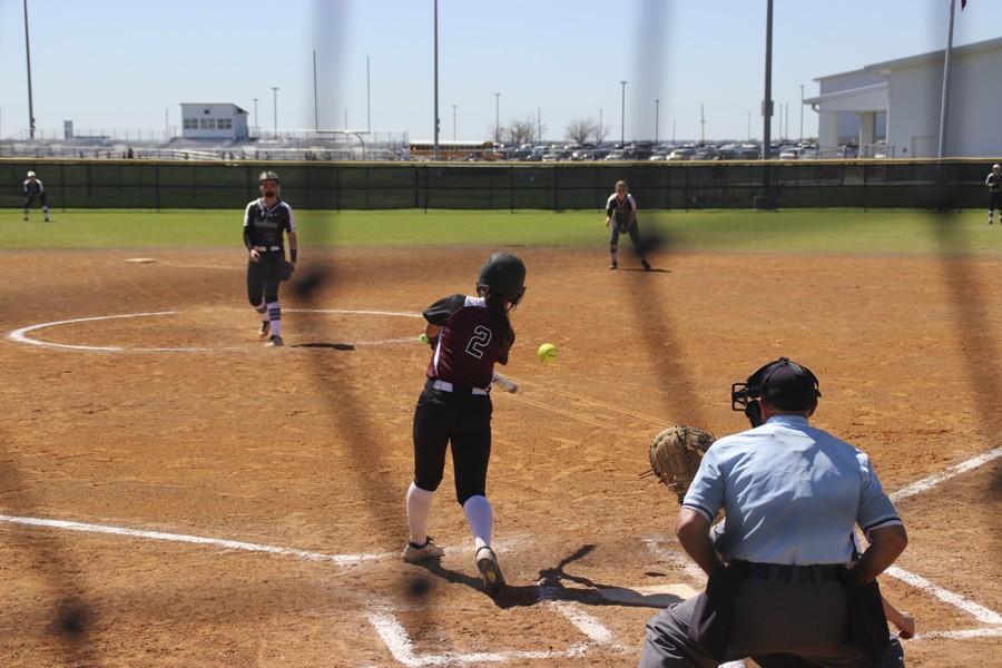 Lily Pearson swings at a fast ball. 