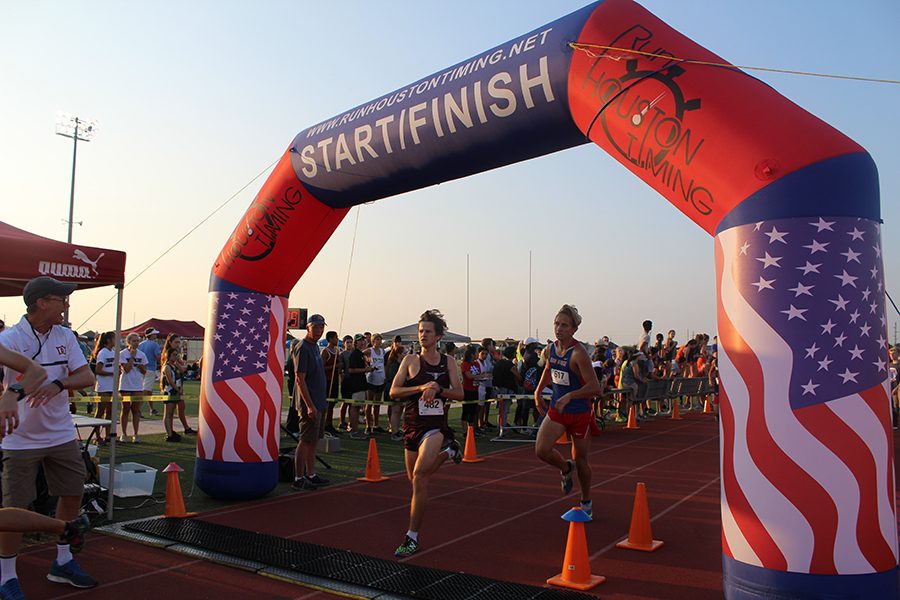 Boy Cross Country runner finishes the race strong. 