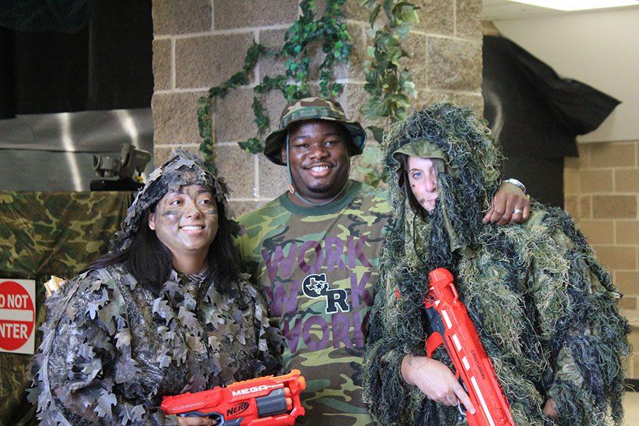 The full body costumed teachers, Ms Torres and Ms. Gonzalez,  separate for their own separate picture with Dr. Black. 