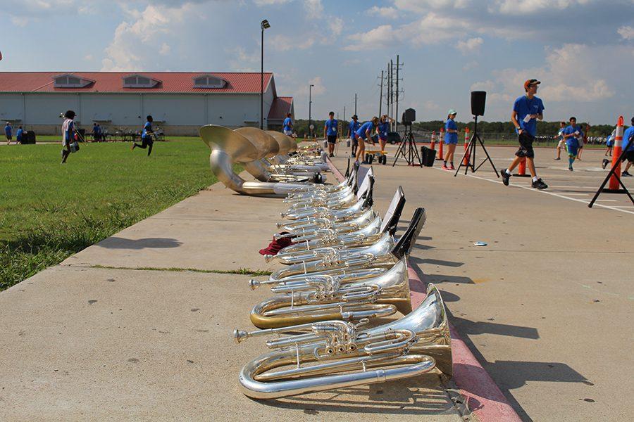 The instruments lined up and waiting for their players to come and get them. 