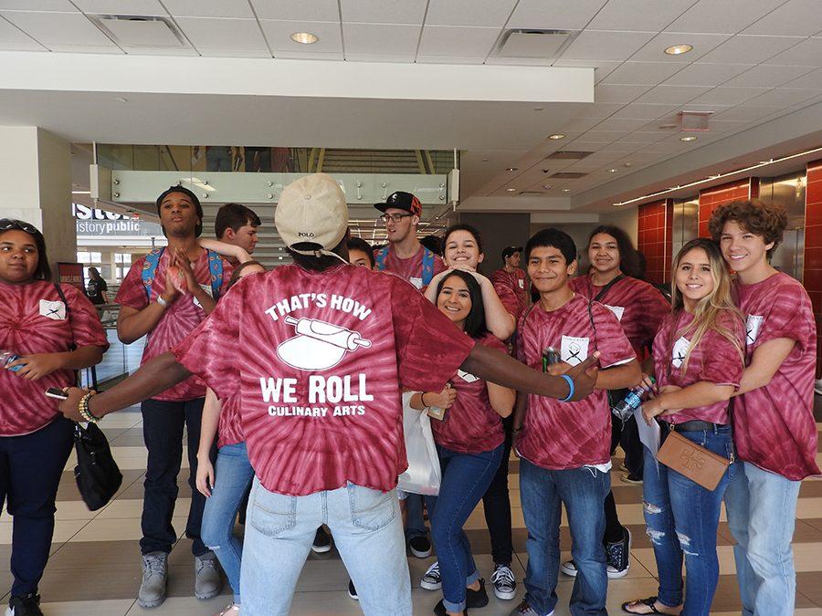 Langston Williams posing in front of the Culinary Arts class at the University of Houston.