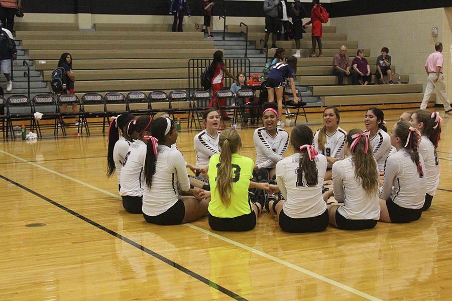 The team gets excited after an amazing win against Alief Taylor.