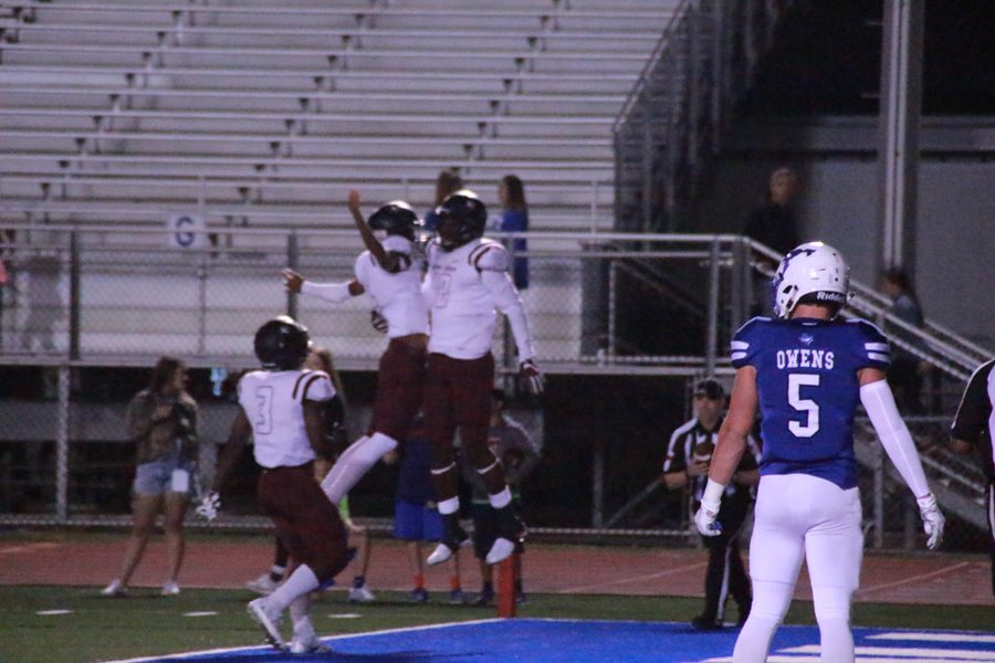 Antonio Jackson, and Quinton Morris celebrate the touchdown.