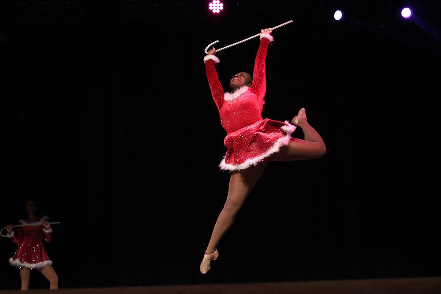 Lariette Colonel, Alexandria Adigun, shows off impeccable form during the officer routine. 