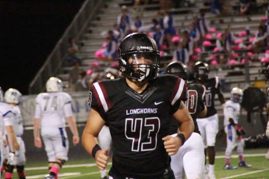 Carson Holloway comes off of the field after makes a big play.