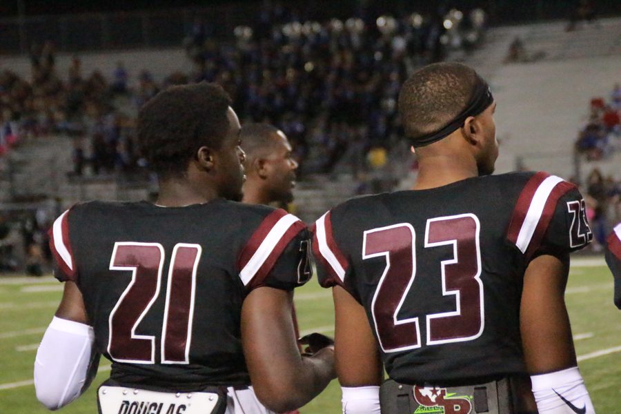 Brent Ugo and Samuel Barnes watch from the sidelines as the game comes to an end.