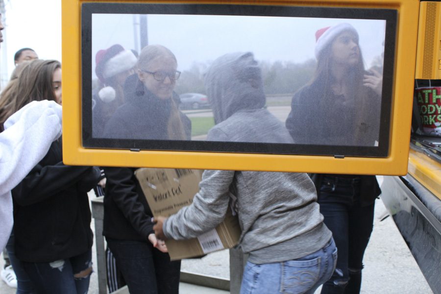 Students working together to unload the donations