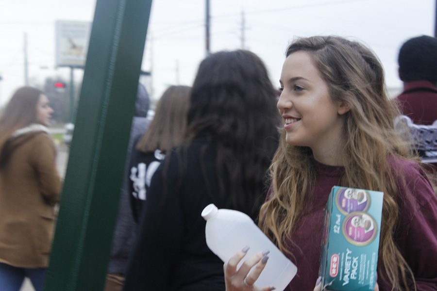 Student smiles before she walks in the highly anticipated pet shelter. 