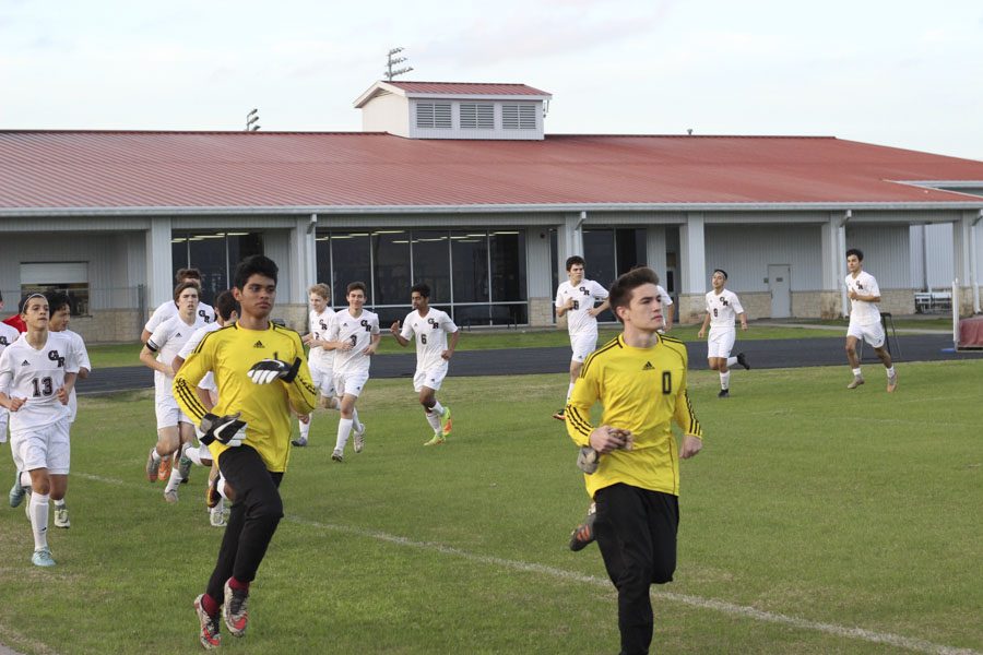 JV A soccer boys are warming up before their game.