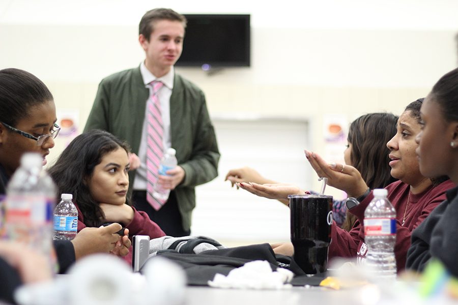 Ms. Baker and her students having a heated discussion about social norms and high school students proposed effects upon society.