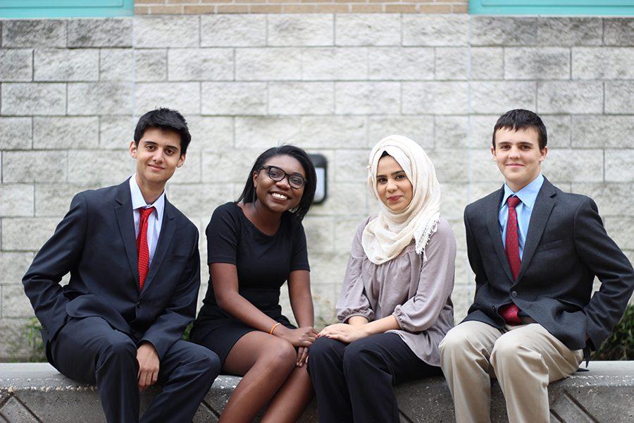 The competing novices posing for a group photo before they go to compete in their debate rounds. 