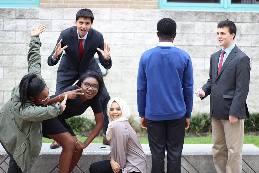 A group photo gone wild with jealousy from the upperclassmen turns into a fun display of team friendship. 