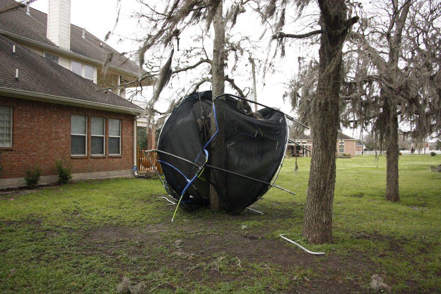 Trampoline blown into tree.