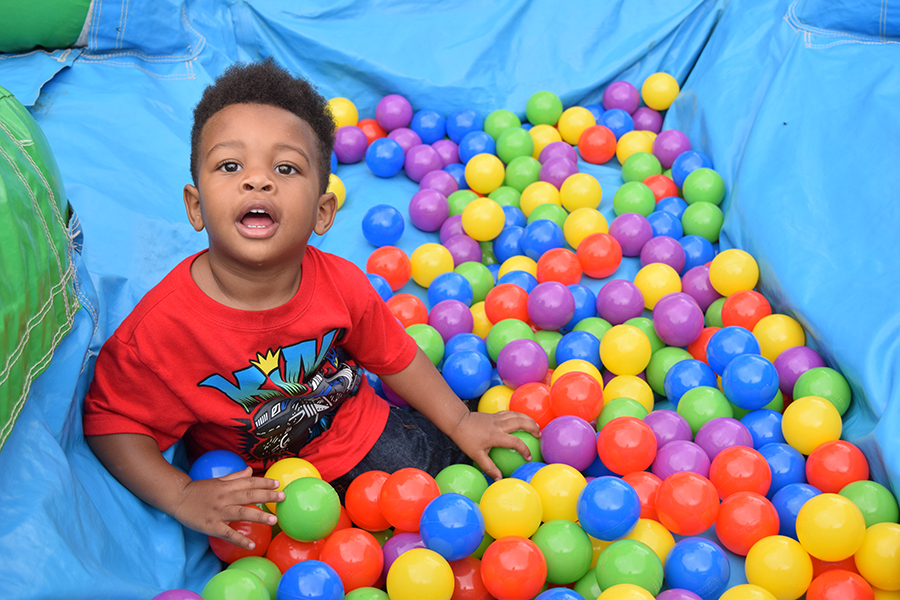 A child playing at the Kids Zone at the Run to Attack Poverty Run.