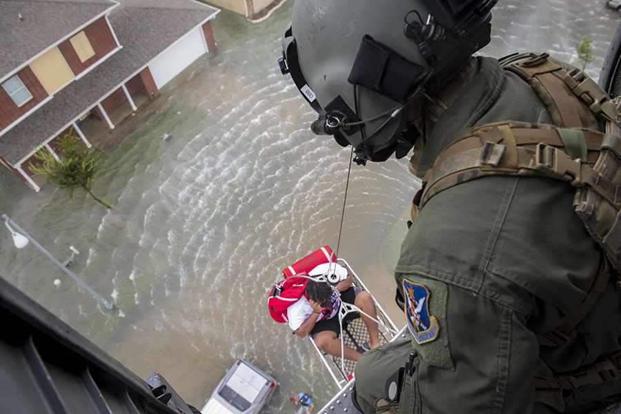 Coast Guard rescuing people through the Harvey flooding