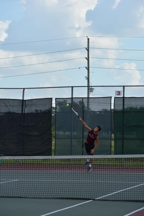 Alex Phan prepares to send the ball to the other side of the court.