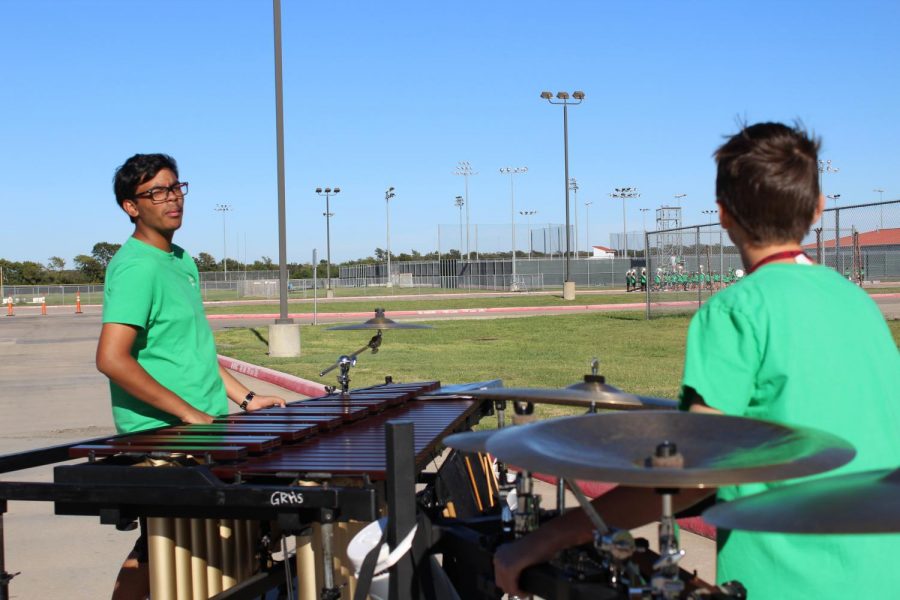 The Front Ensemble goes to join the rest of the band. 