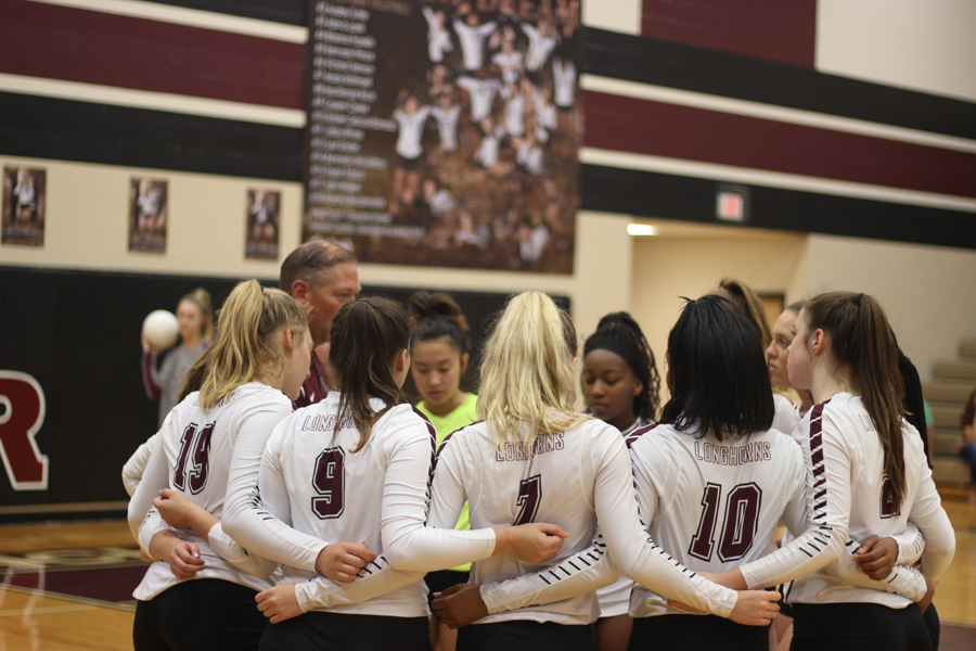 Coach Reeves and the girls discussing the game.