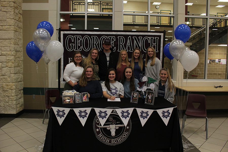 Lexie Shafer hanging out with her friends at the signing table. 